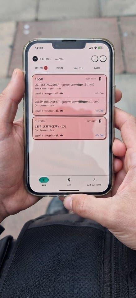 A BackPedal recovery agent holding a phone with the agent app open