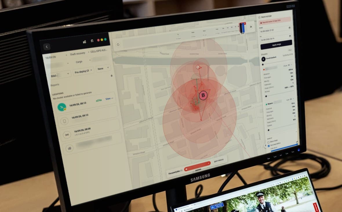 An office monitor showing BackPedal's recovery platform tracking a stolen bike, with customer details blurred