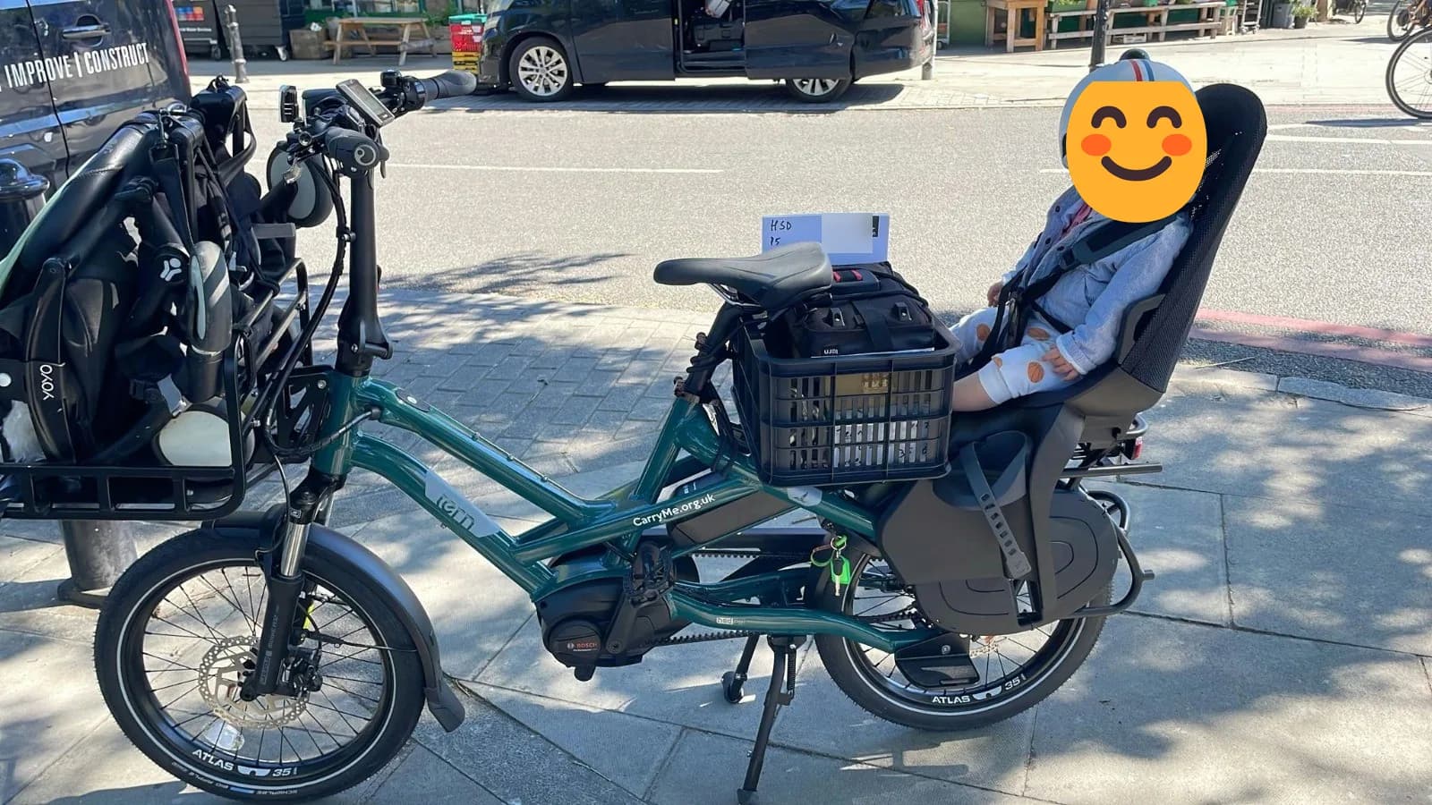 The green Tern HSD cargo e-bike before it was stolen, with a child seat on the back